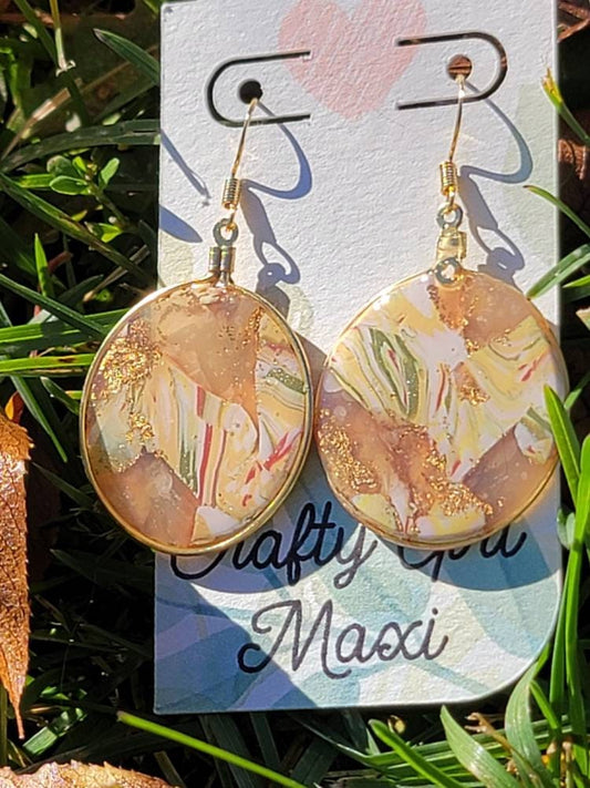 Fall hoop clay earrings made in autumn gold tones. Handmade round autumn clay earrings. Statement earrings. Lightweight modern earrings.